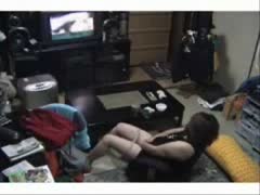 A concealed camera records a cock-starved wife masturbating indoors.